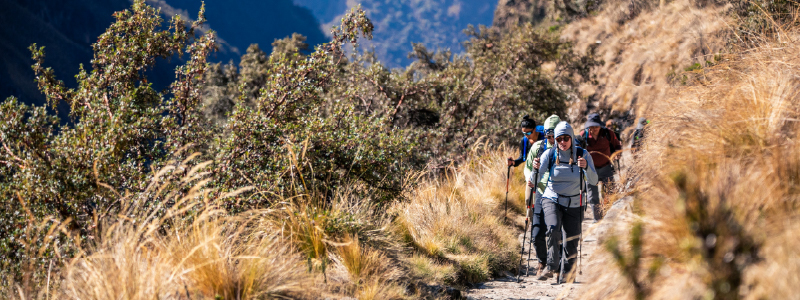 Hiker trekking near Humantay Lake during Cusco adventure trip